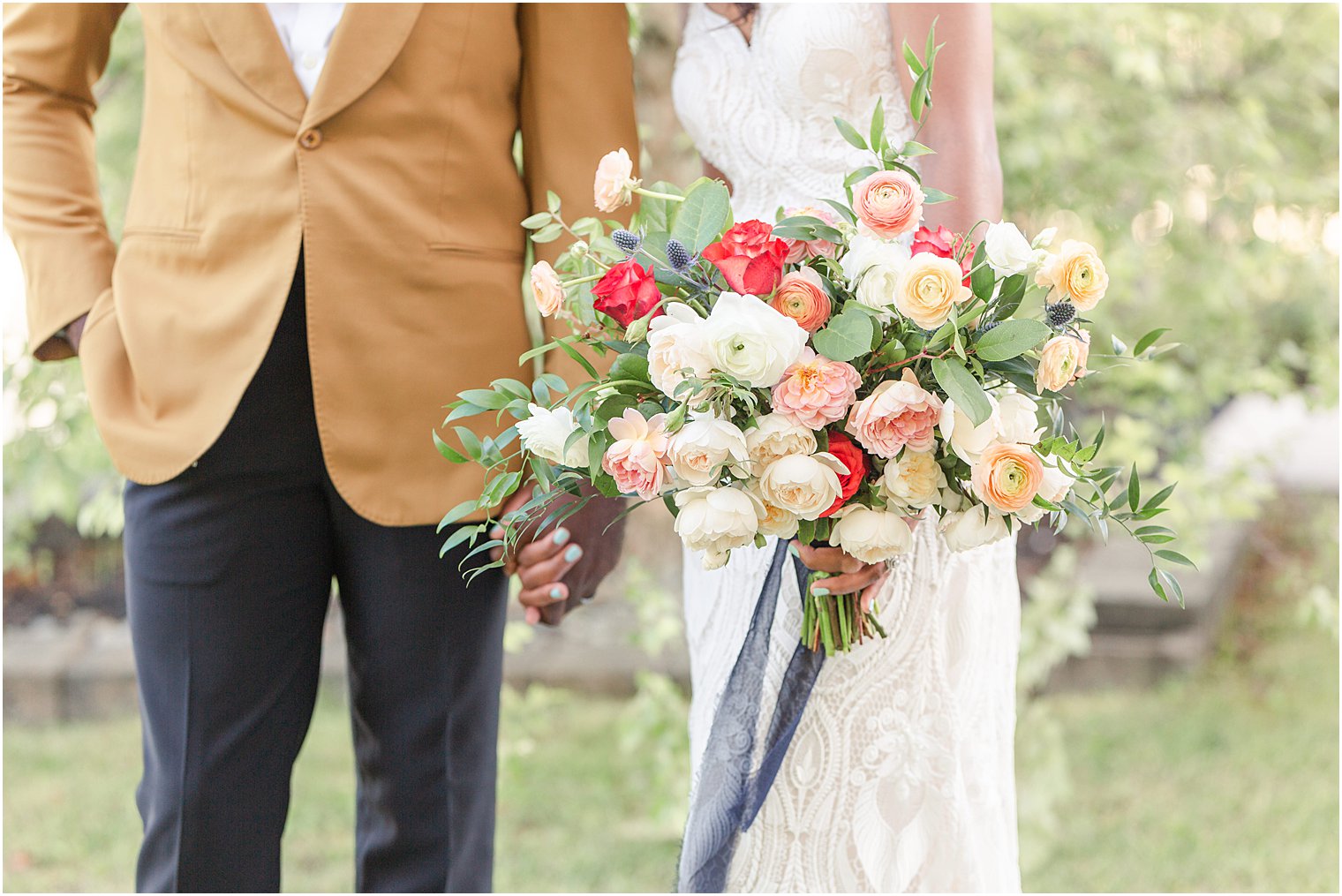 Bride holding floral arrangement at wedding editorial shoot