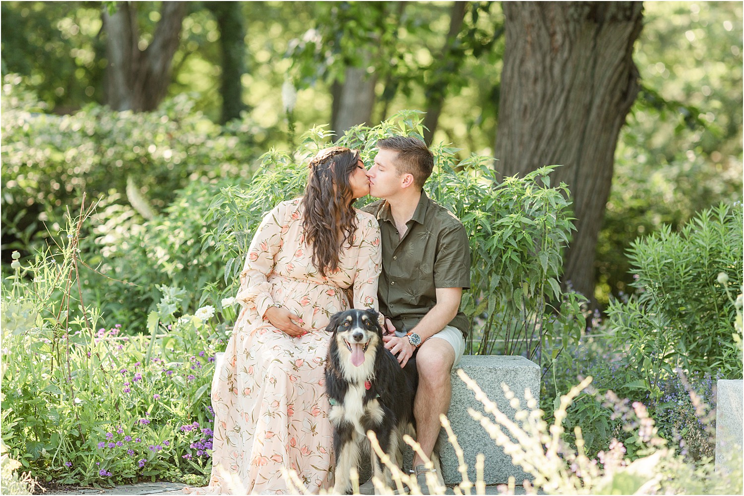 couple kiss as their dog sits nearby photographed by Jocelyn Cruz Photography