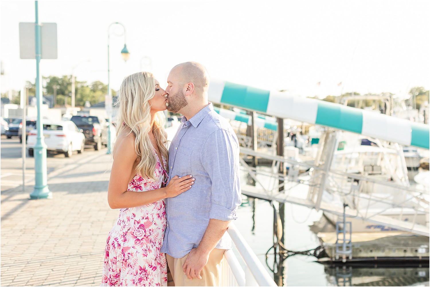 NJ couple kiss at NJ Marina and beach during engagement session