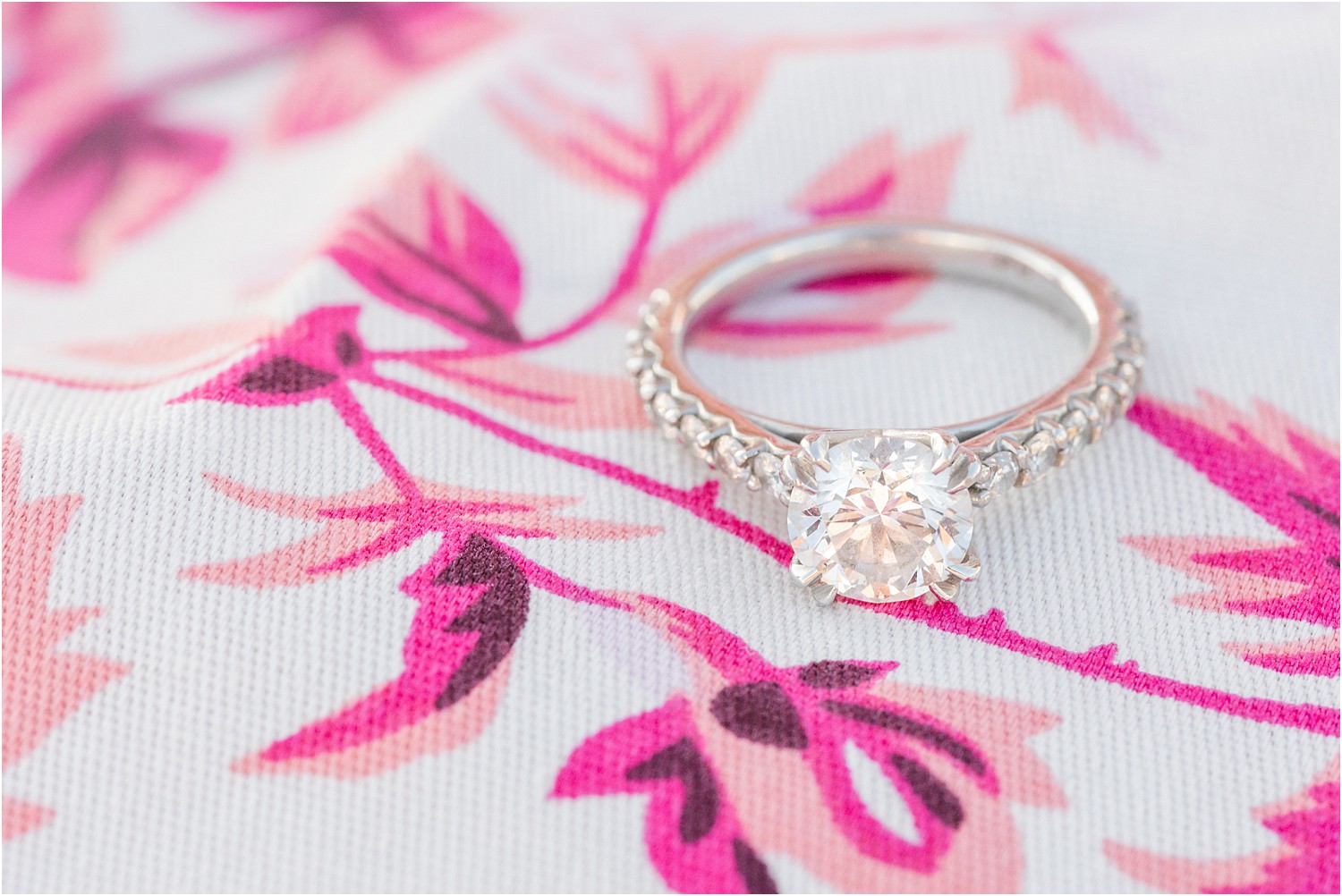 Engagement ring on fabric of woman's dress from Belmar Marina + Beach Engagement Session