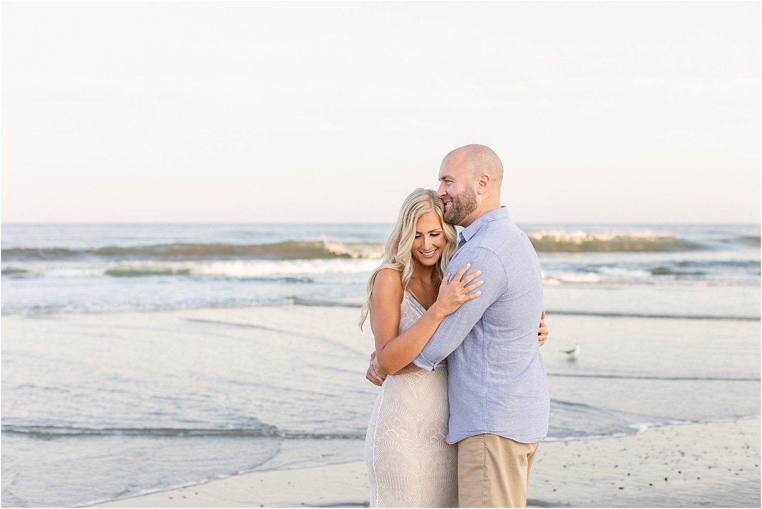 couple share a few laughs at Belmar Beach engagement session