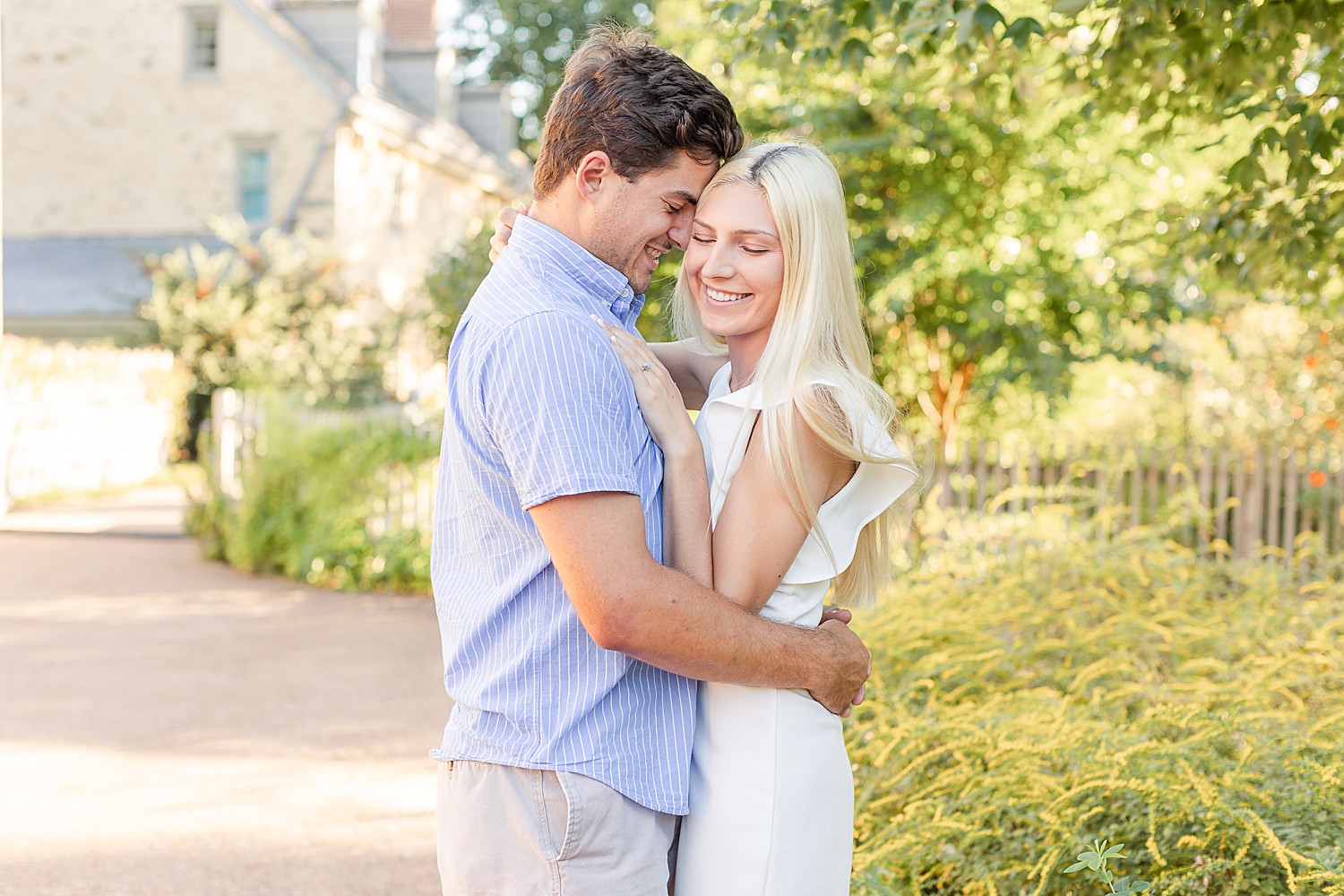 engaged couple hugs in garden in PA