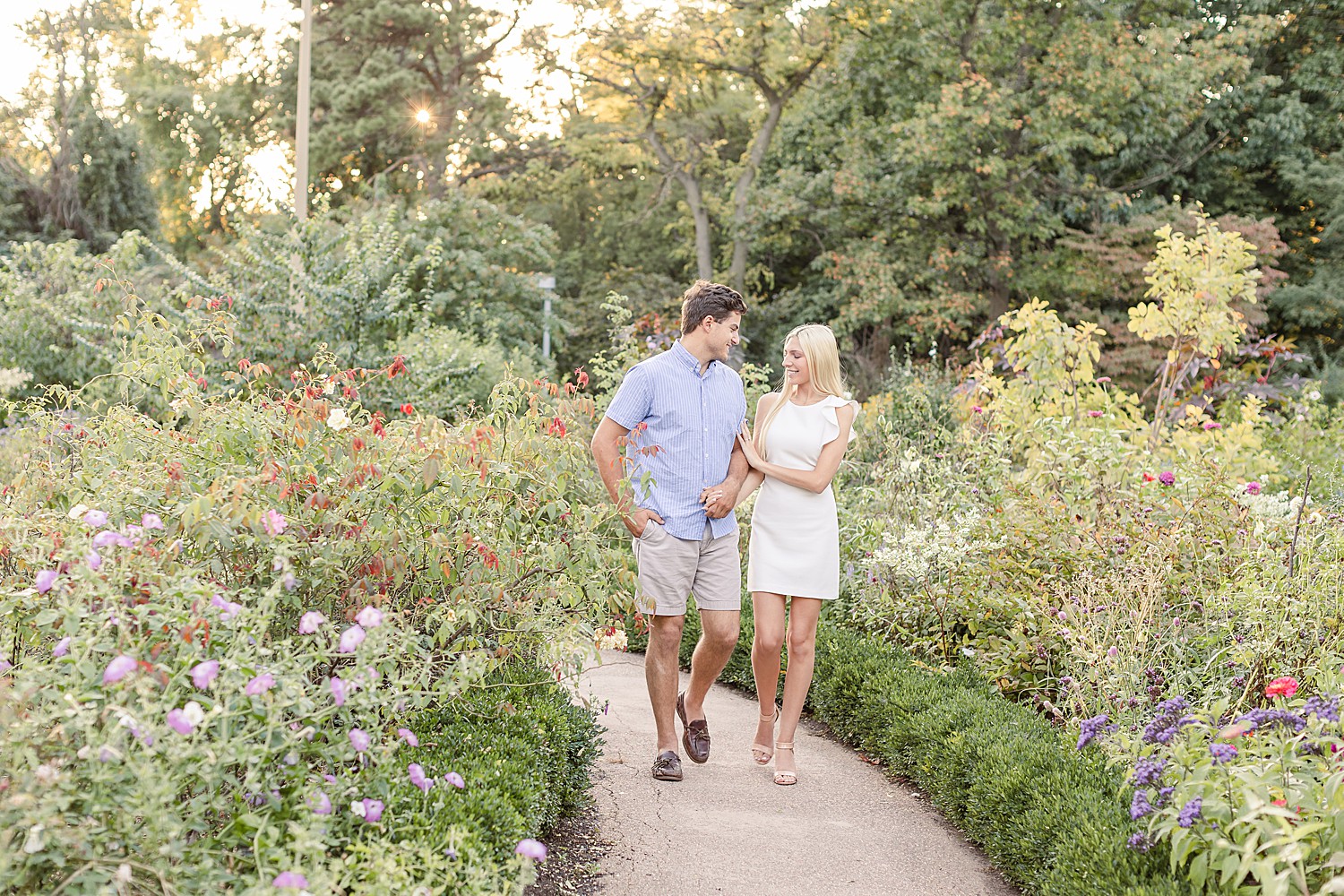 couple walk through garden in Philadelphia PA