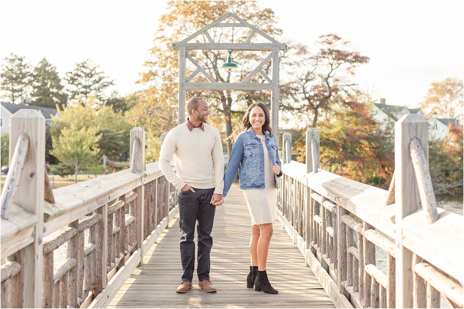 Couple on bridge during engagement photos