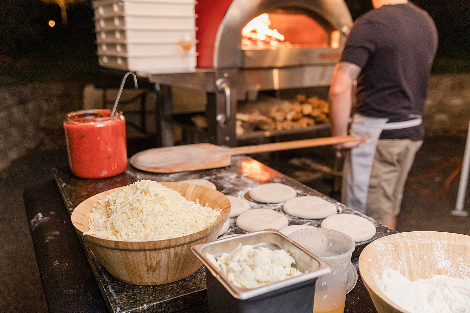 wood fired pizzas made as goodnight snacks for wedding guests