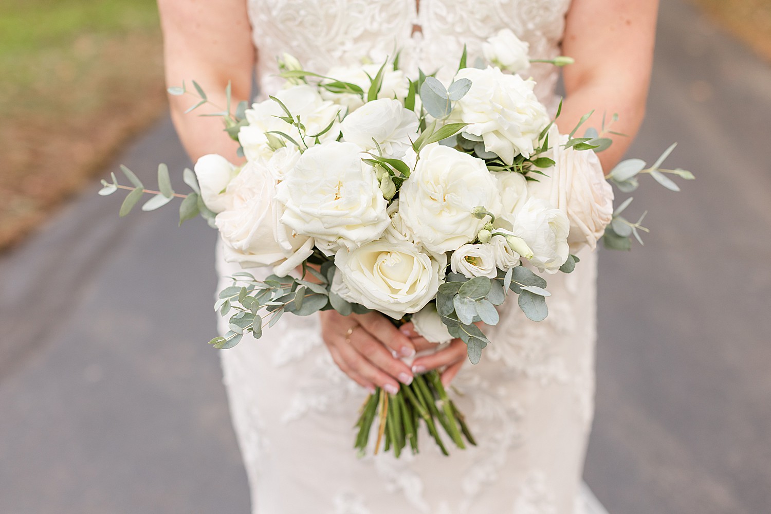 bride shows of white wedding bouquet 