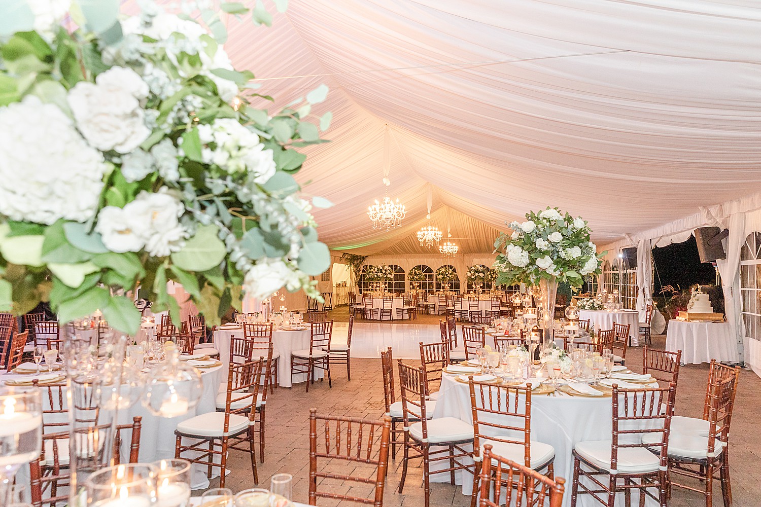 wedding reception details and flowers in outdoor tent at Windows on the Water at Frogbridge 