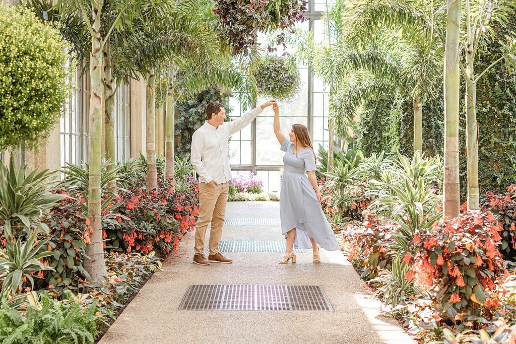 couple dances during Romantic Spring Engagement at Longwood Gardens in PA
