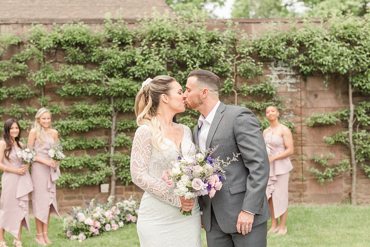 couple kiss at Elegant European-Inspired Wedding at Tyler Gardens