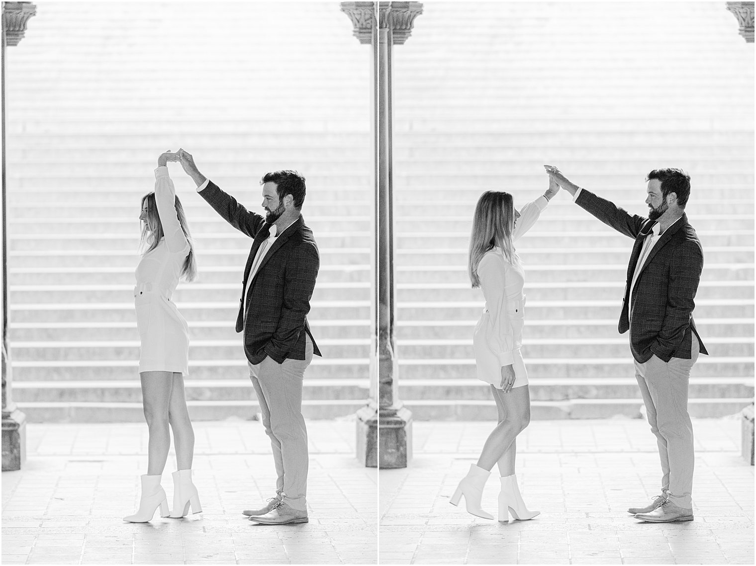 engaged couple dance at the bottom of stairs
