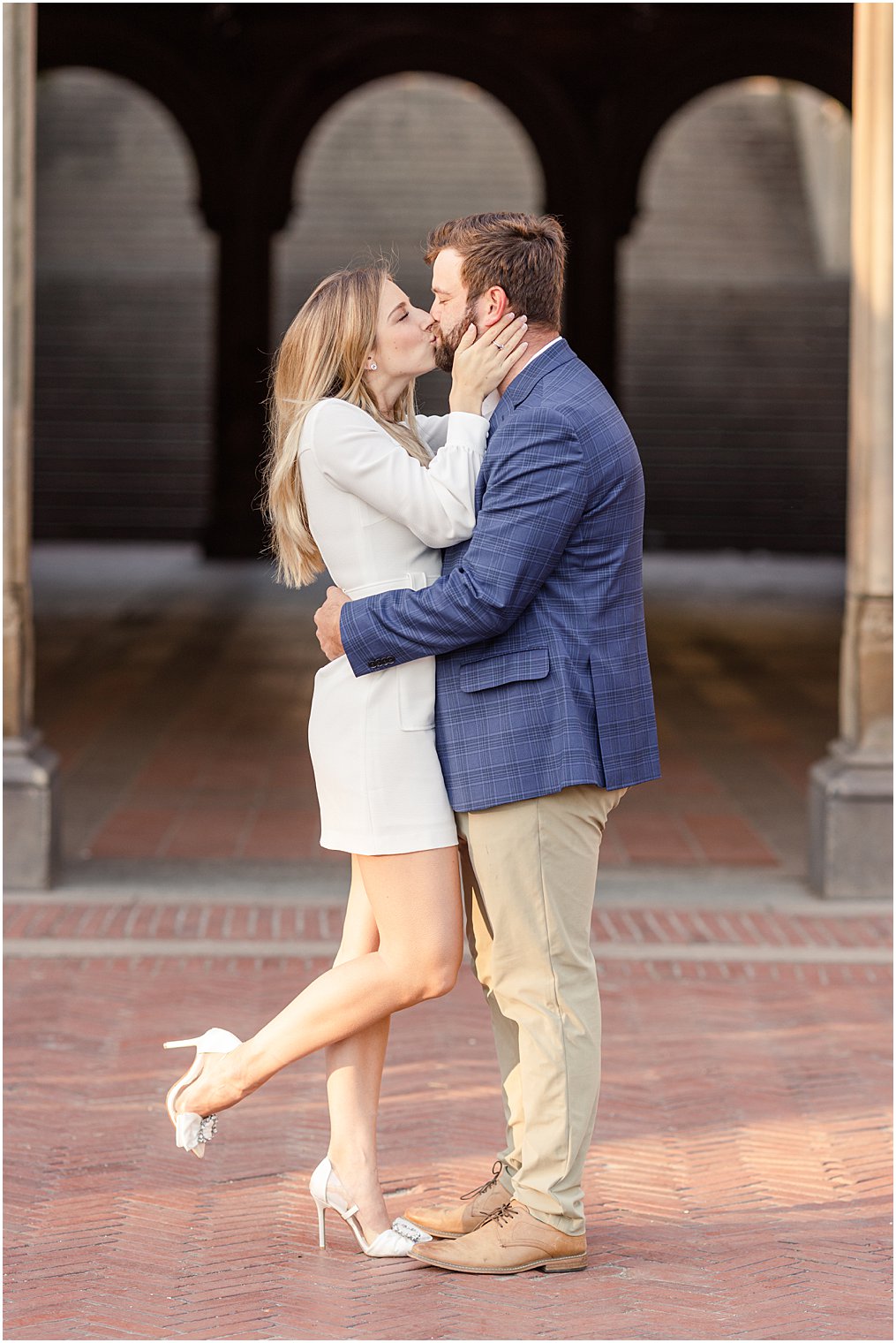 engaged couple kiss during their Central Park NYC engagement session