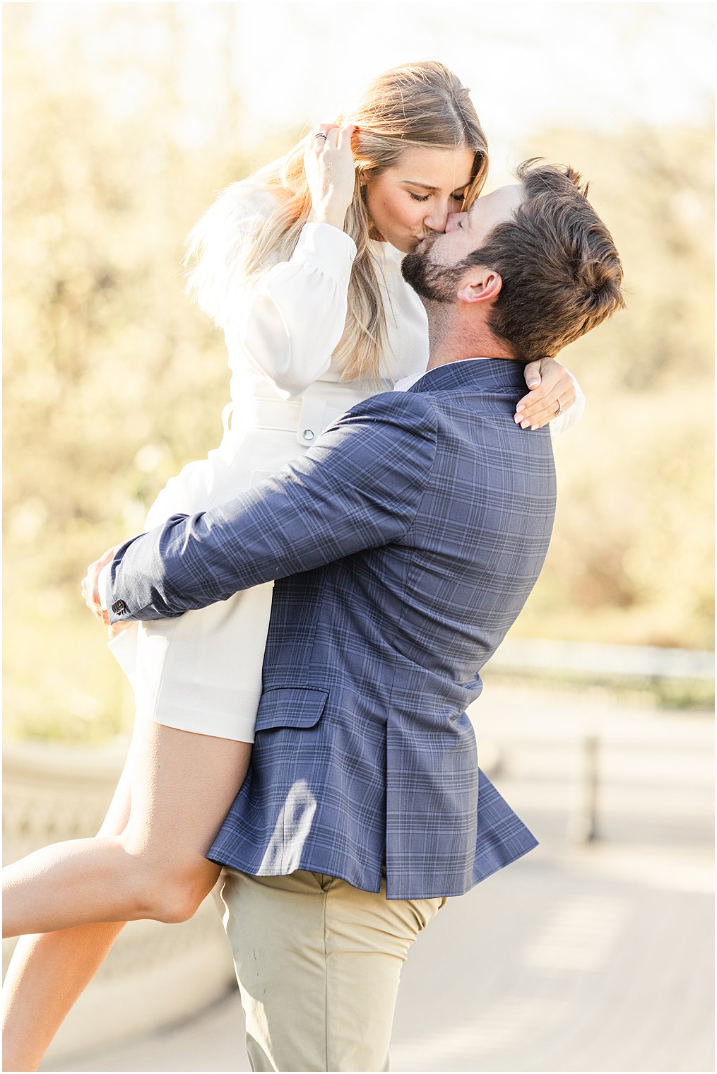 newly engaged couple kiss during Central Park NYC engagement session