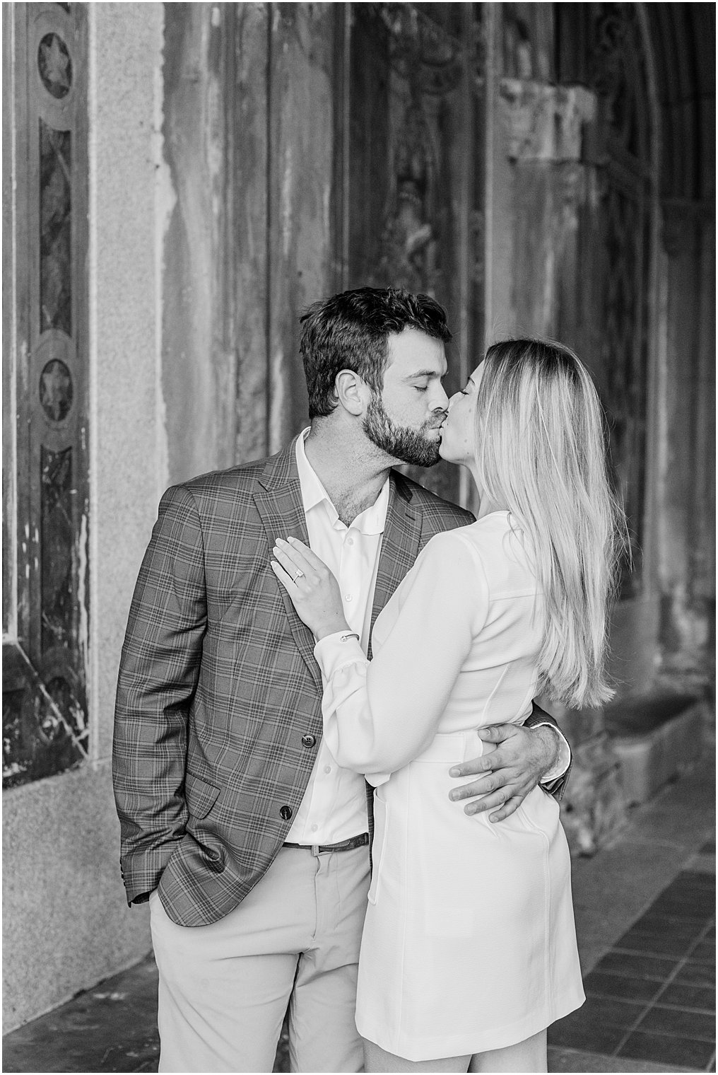 black and white photo of couple kissing during engagement portraits