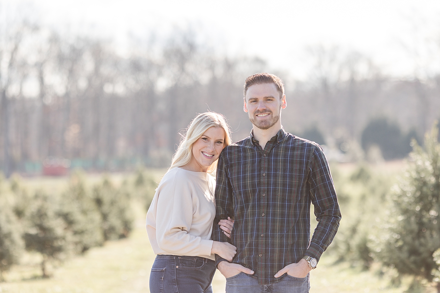 Winter engagement at a Christmas tree farm