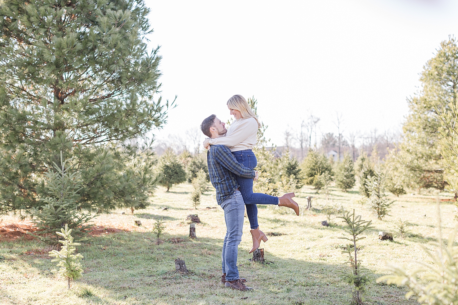 man lifts his fiance up 