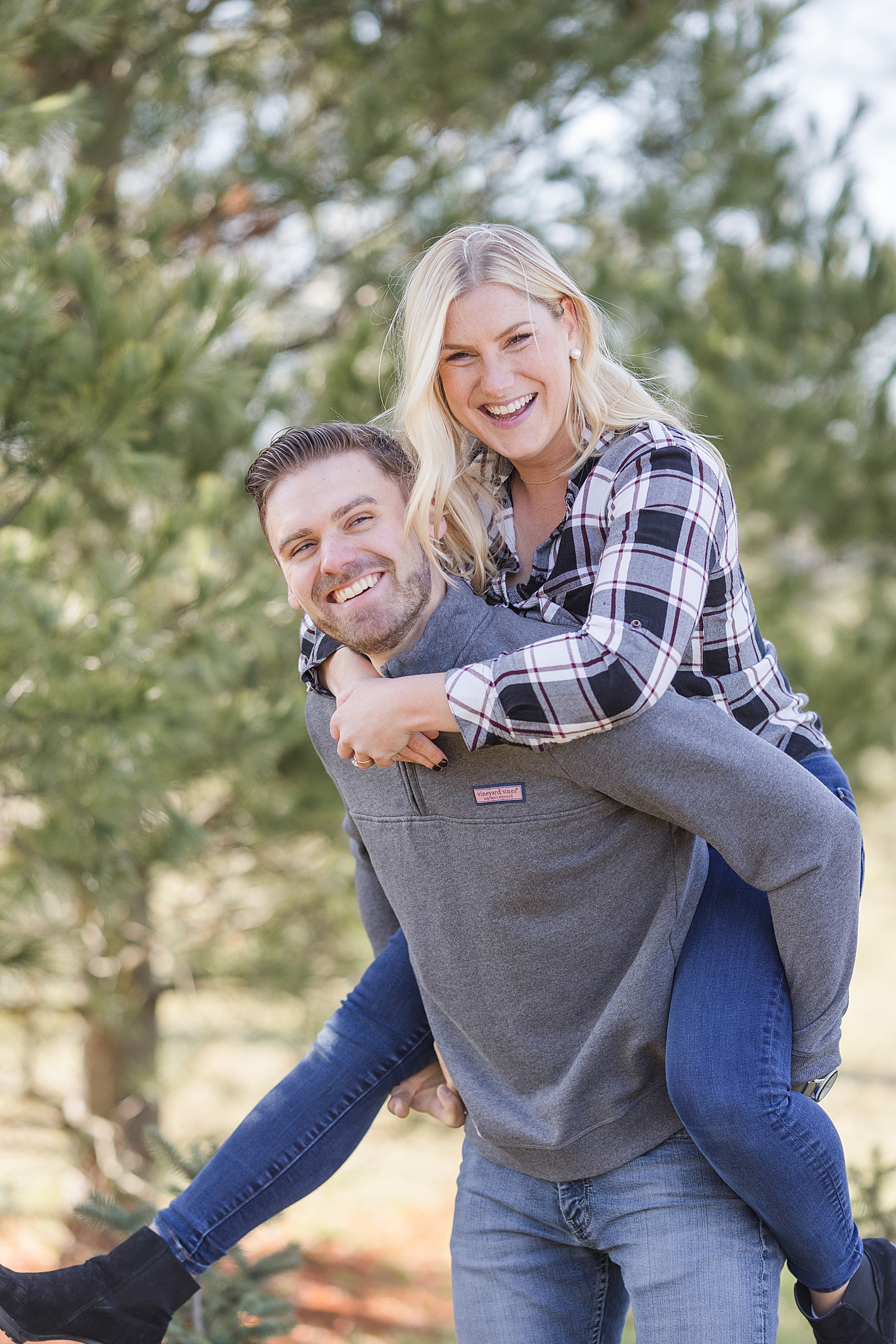 joyful engagement photos from Christmas tree farm engagement 