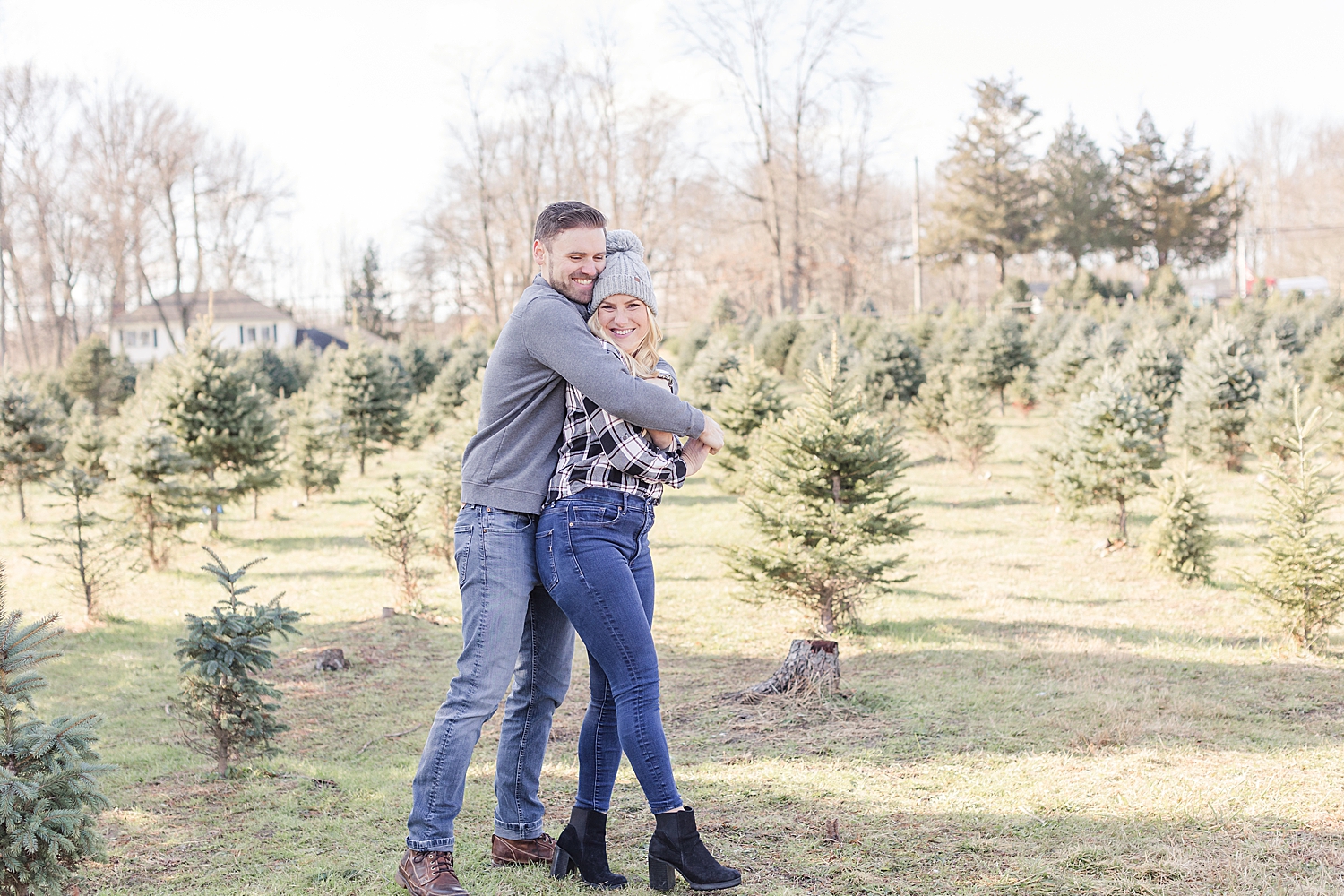 Christmas tree farm engagement in December