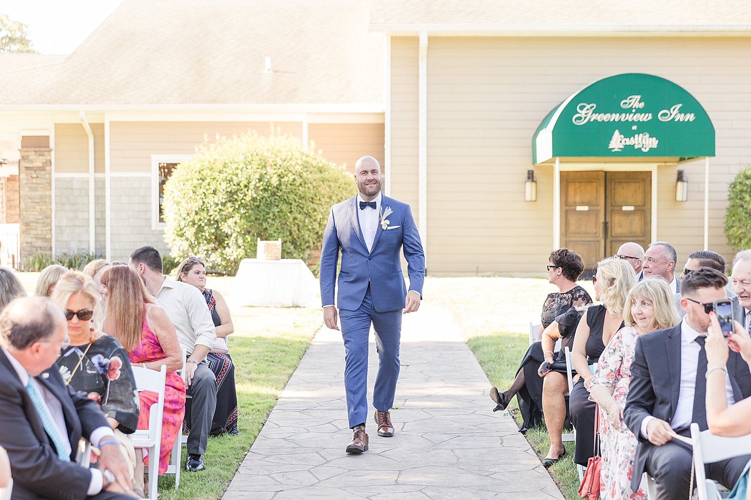 groom walks down aisle