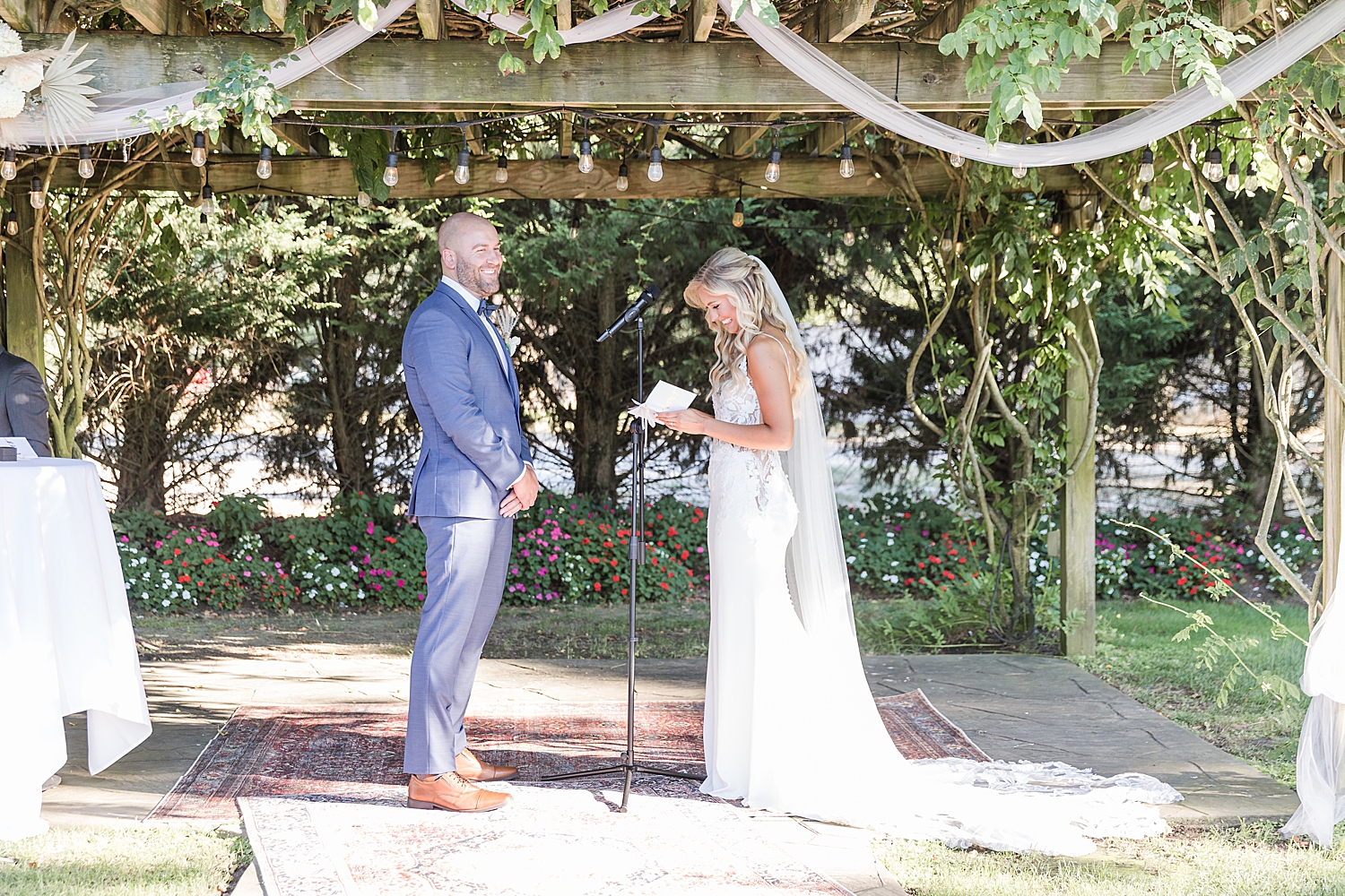 bride reads her wedding vows