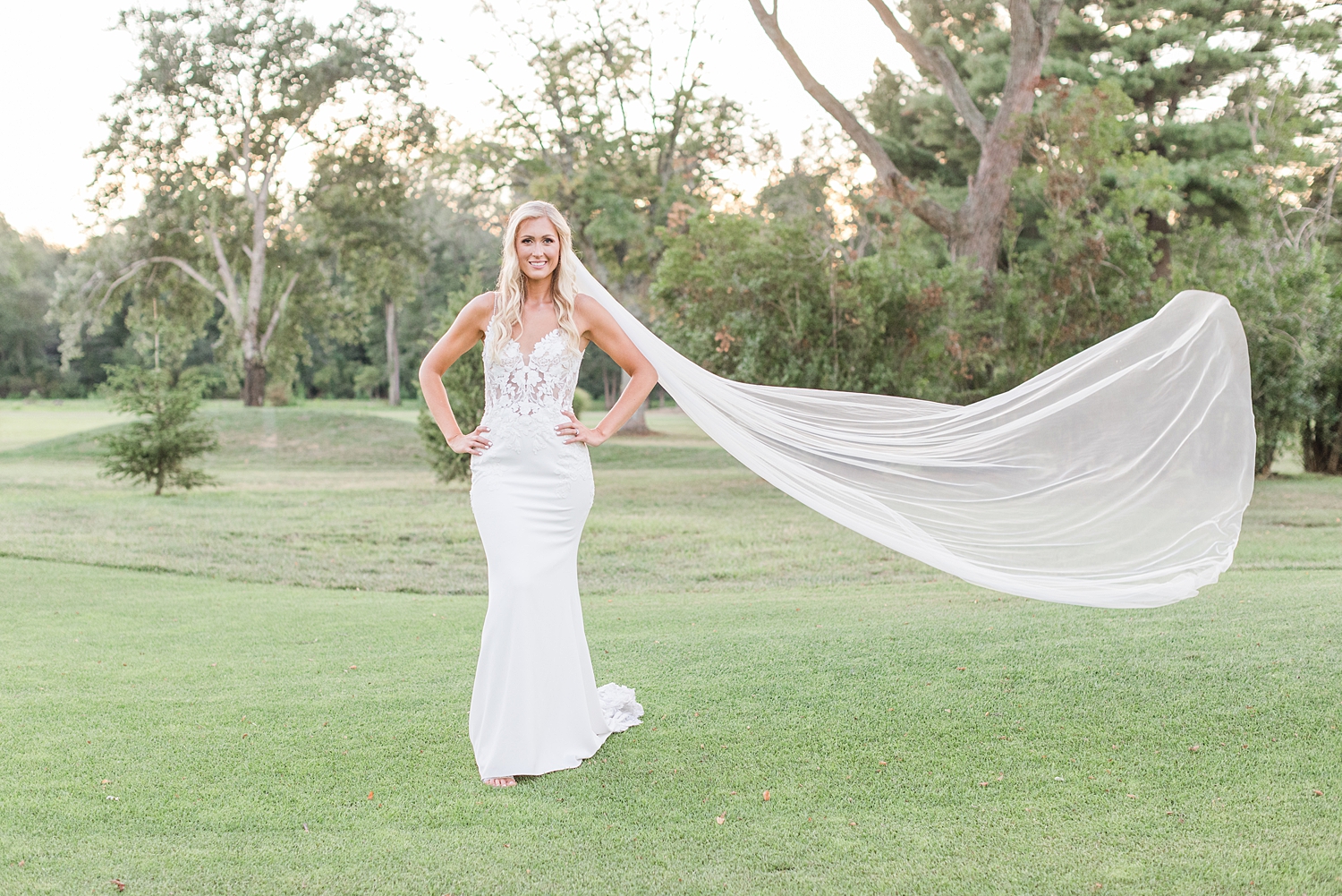 bridal portraits with veil flowing around from Boho Inspired Summer Wedding at Eastlyn Golf Course