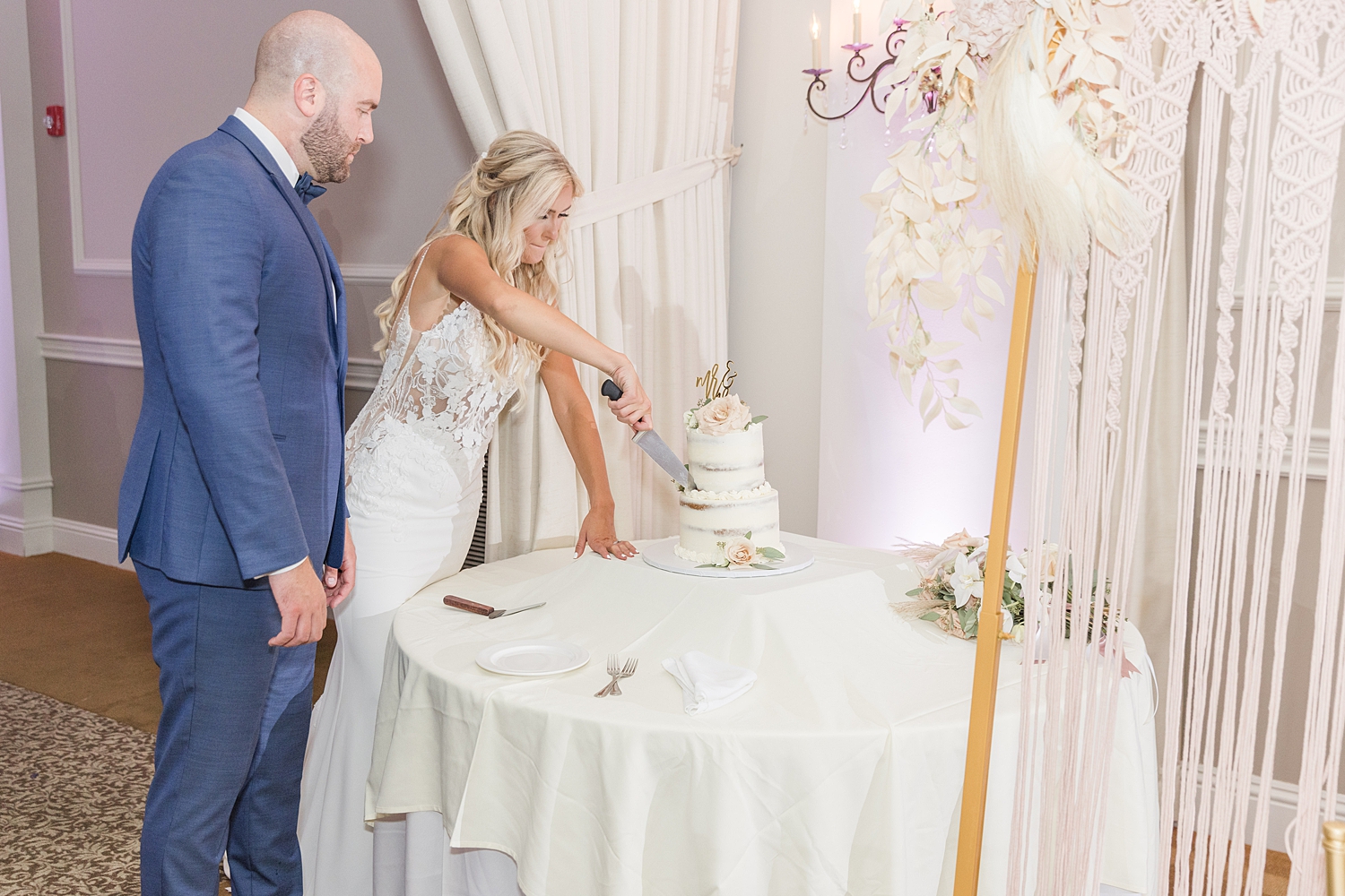 couple cut their wedding cake