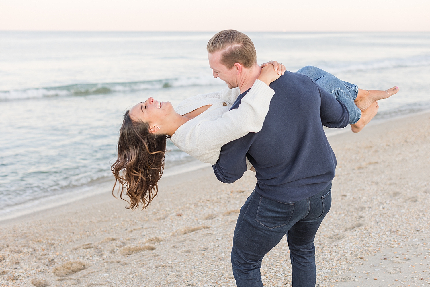 joyful engagement photos on the beach