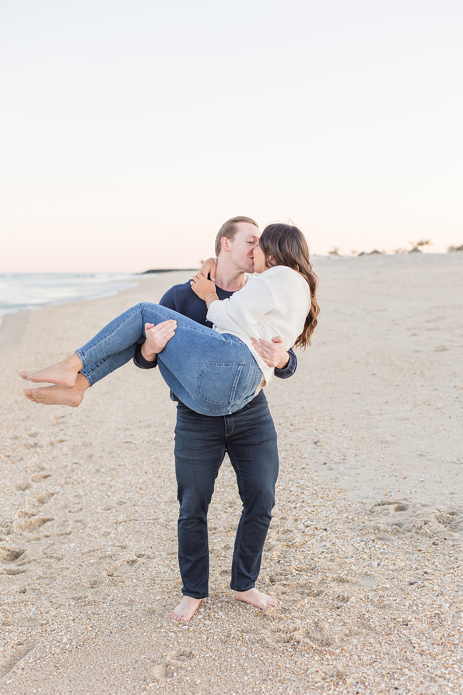 engaged couple kiss 