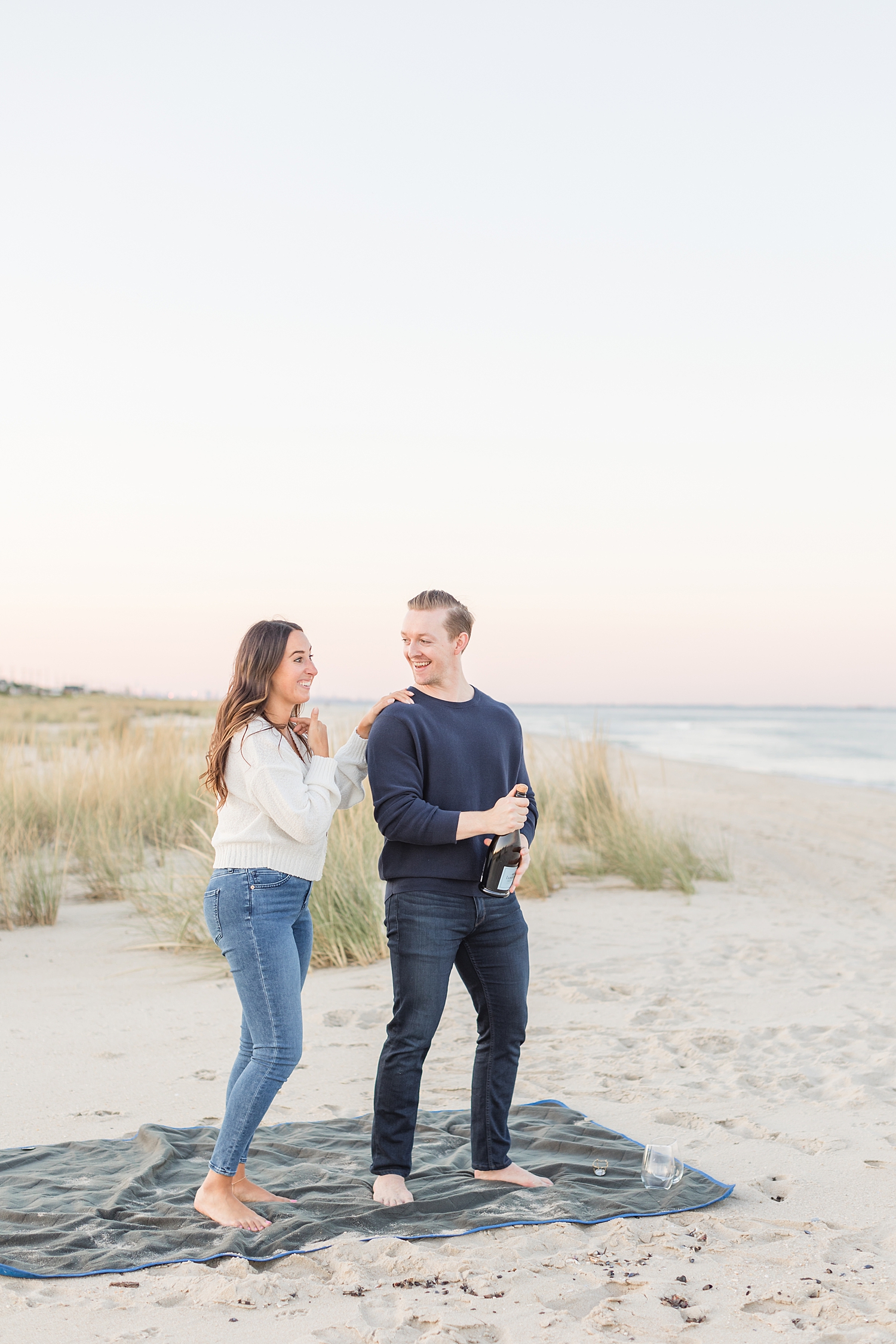 couple open bottle of champagne 