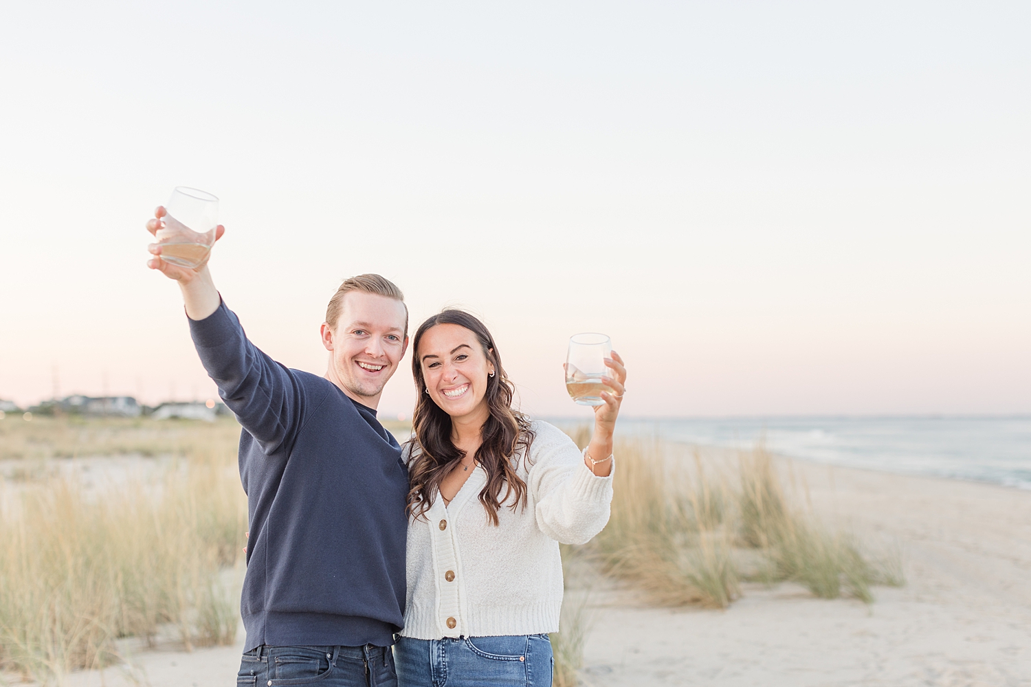 couple toast their engagement with champagne 