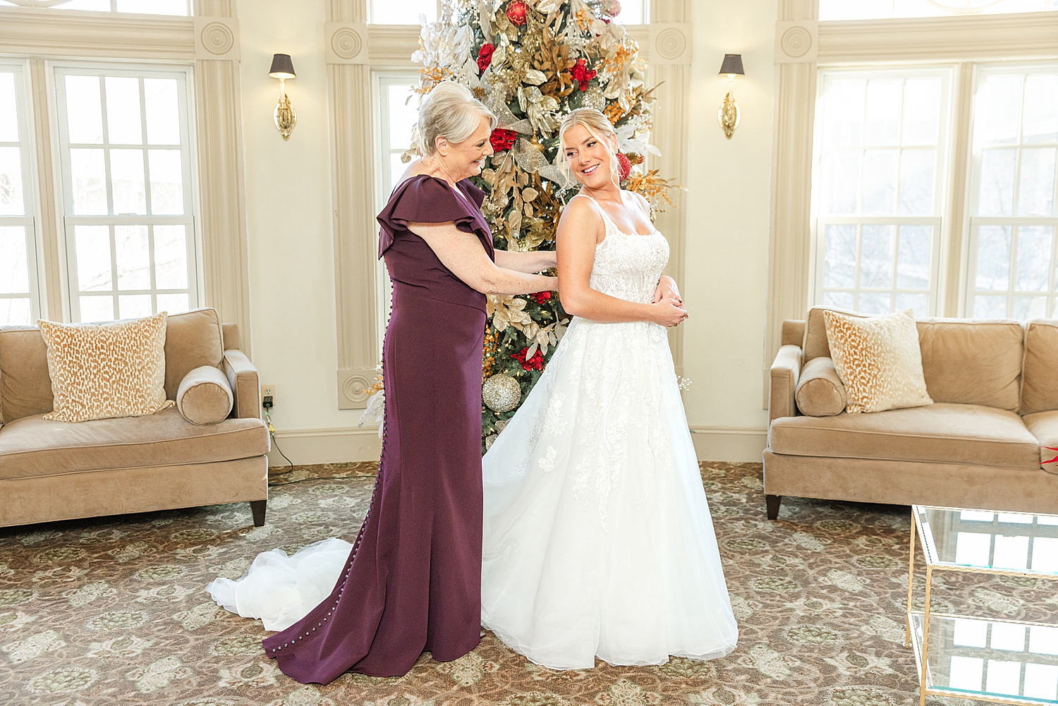 bride gets intp wedding dress with mom