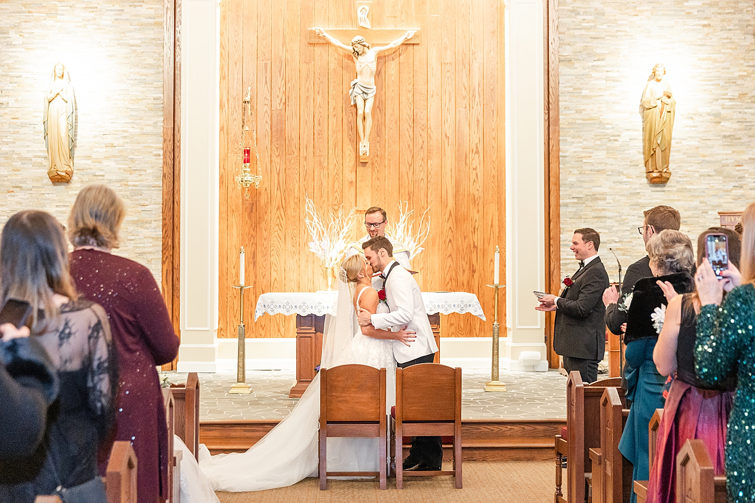 newlyweds kiss at wedding ceremony 