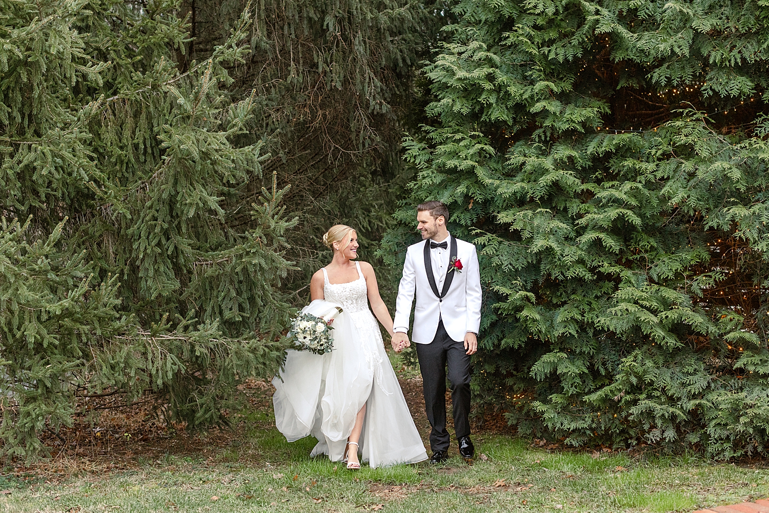 romantic wedding photos surrounded by pine trees