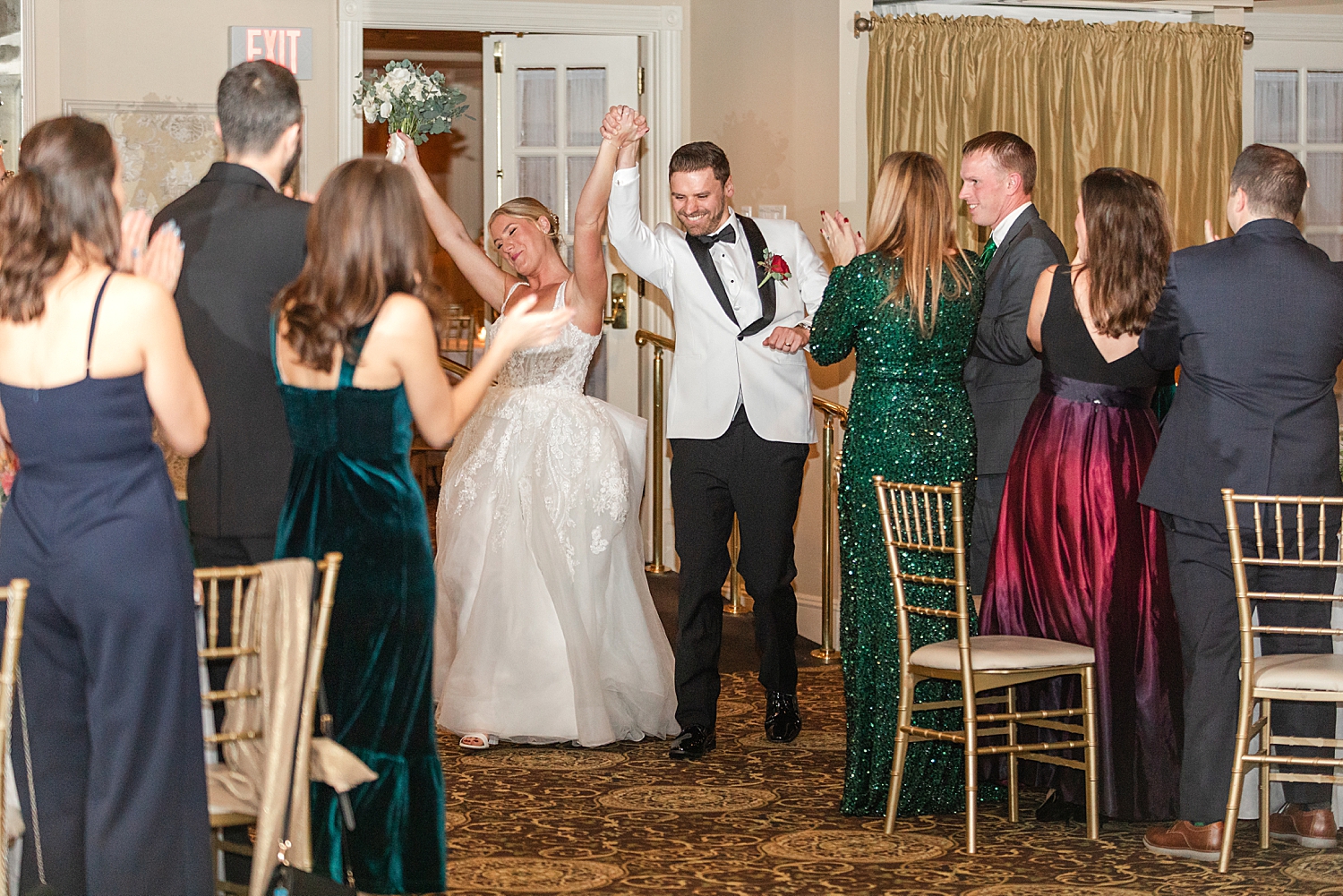 newlyweds enter wedding reception