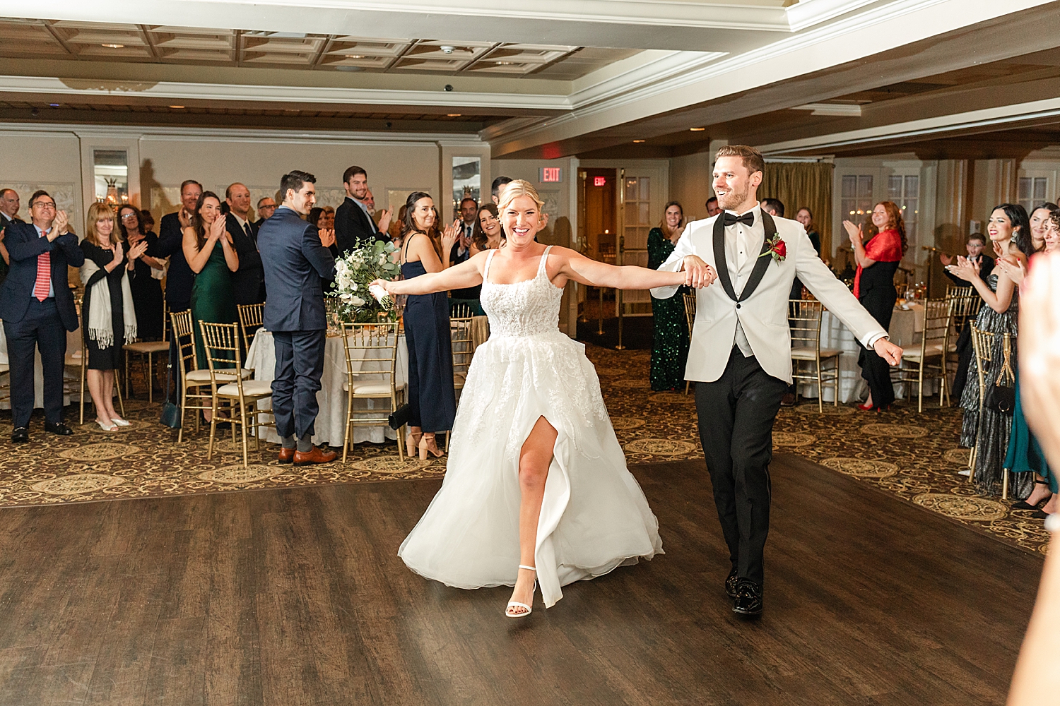 newlyweds walk onto dance floor