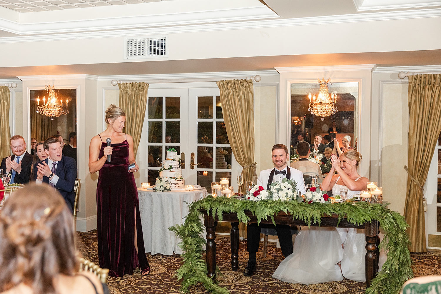 couple listen to wedding toasts 