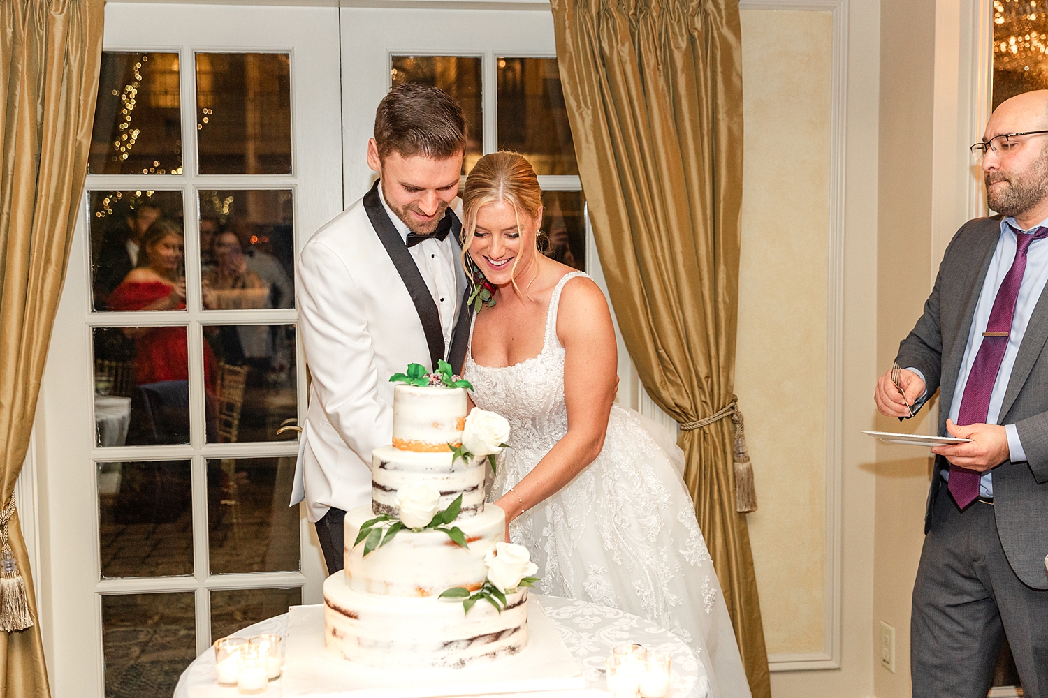 bride and groom cut their wedding cake