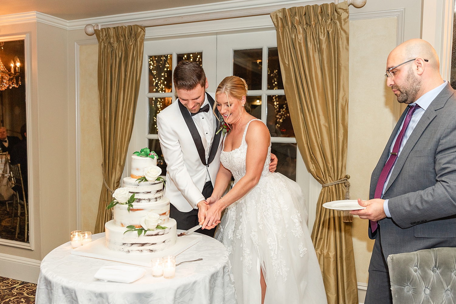 couple cut their wedding cake