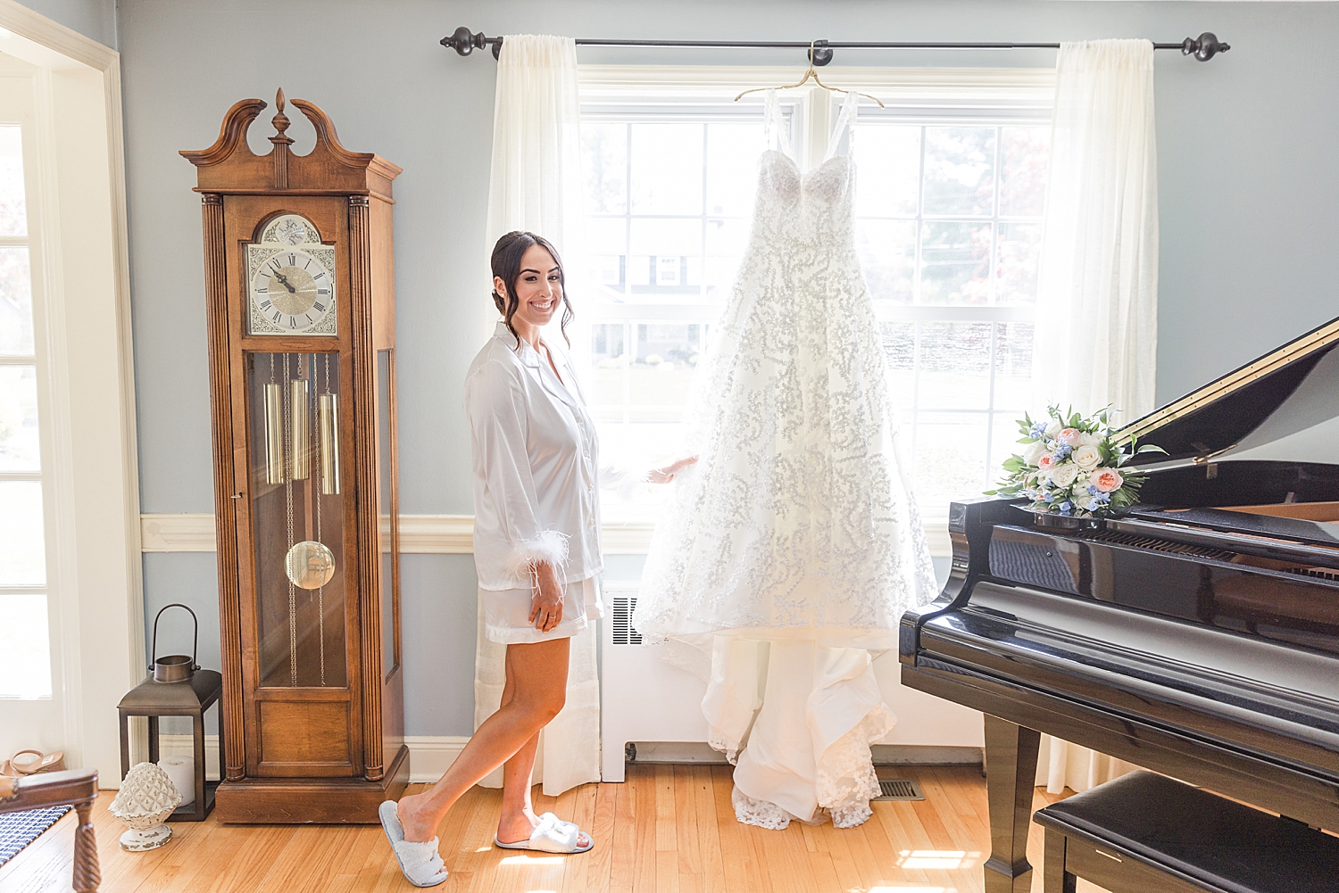 bride holds wedding dress