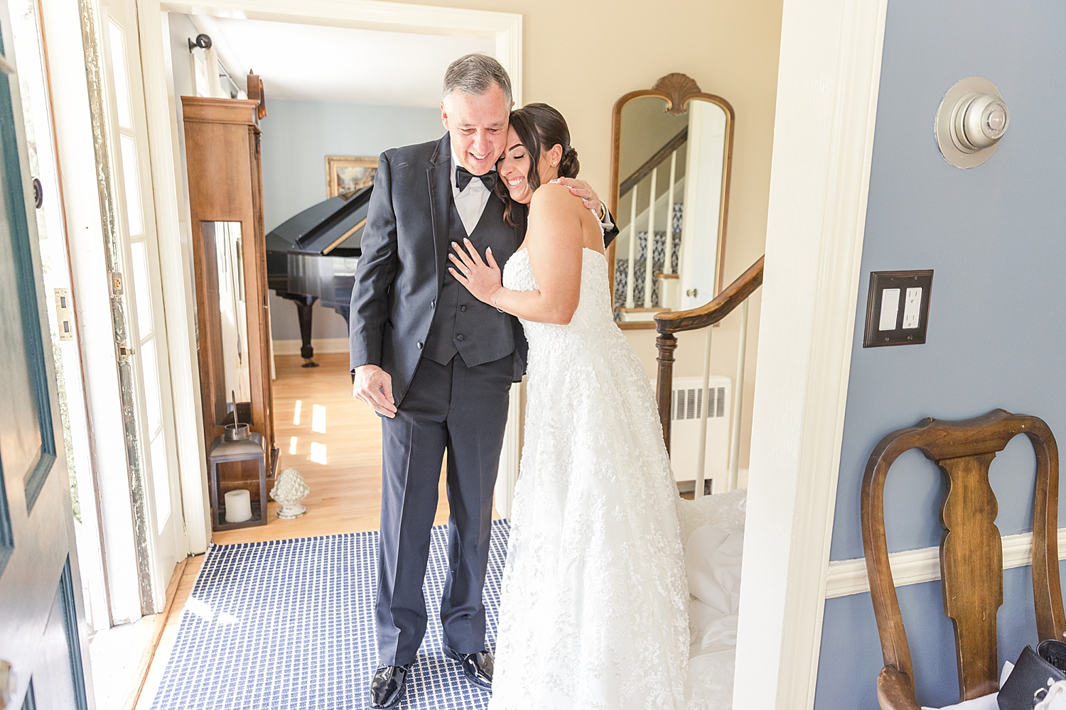 bride hugs her dad during first loook