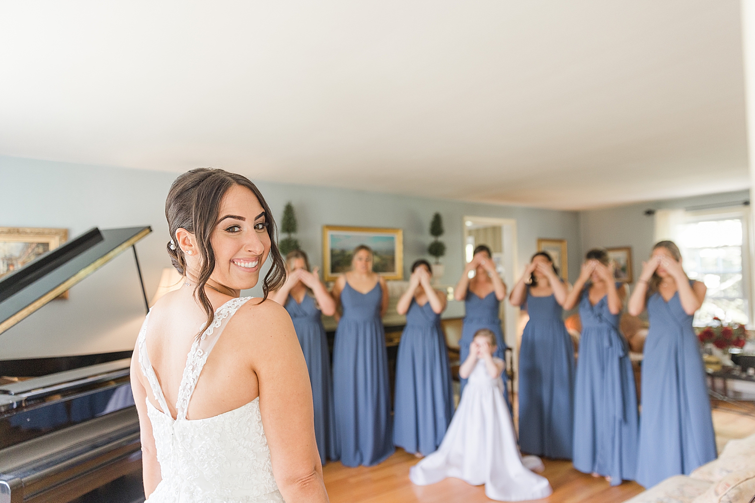 bride moments before first look with bridesmaids