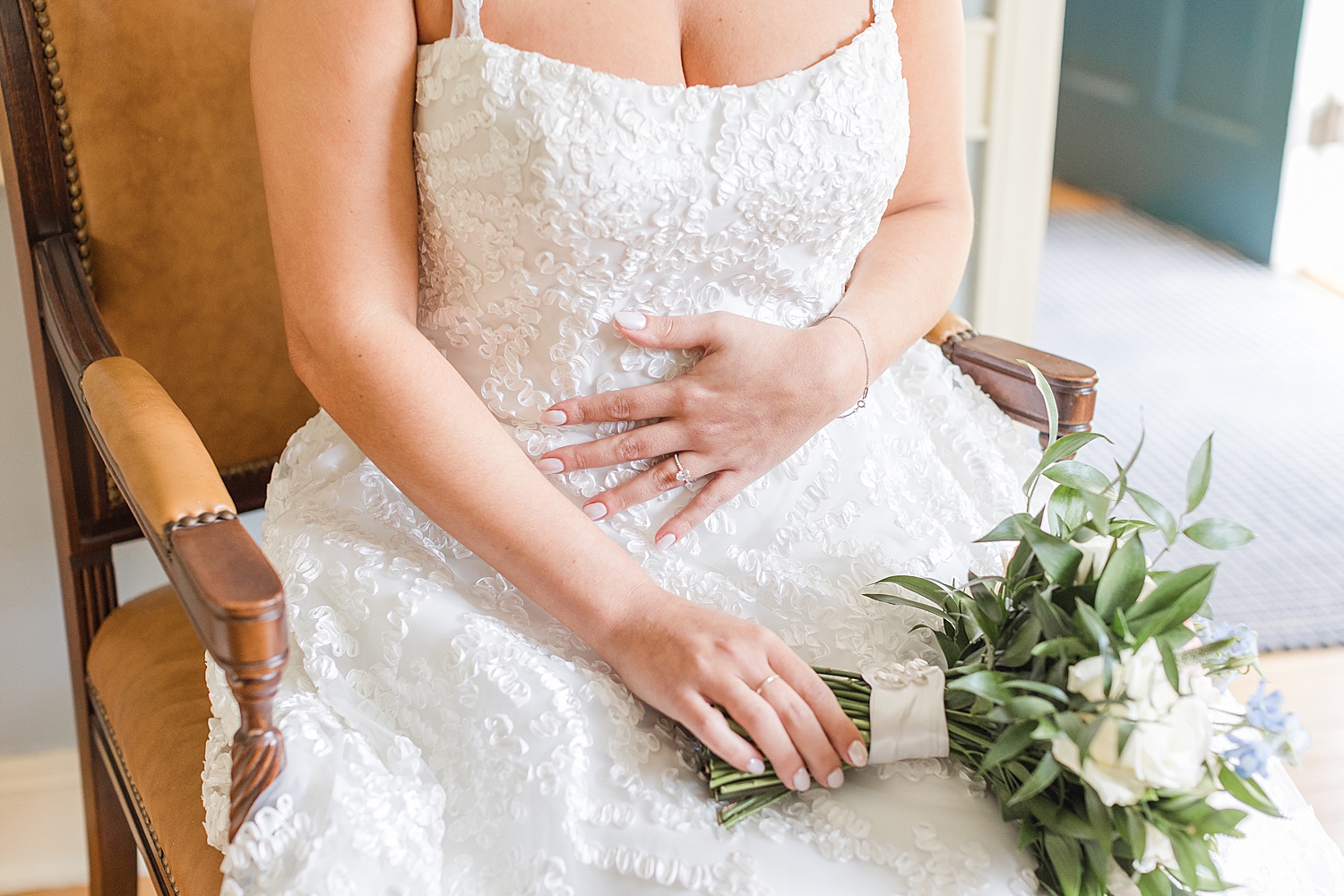 bride in wedding dress holding bridal bouquet 