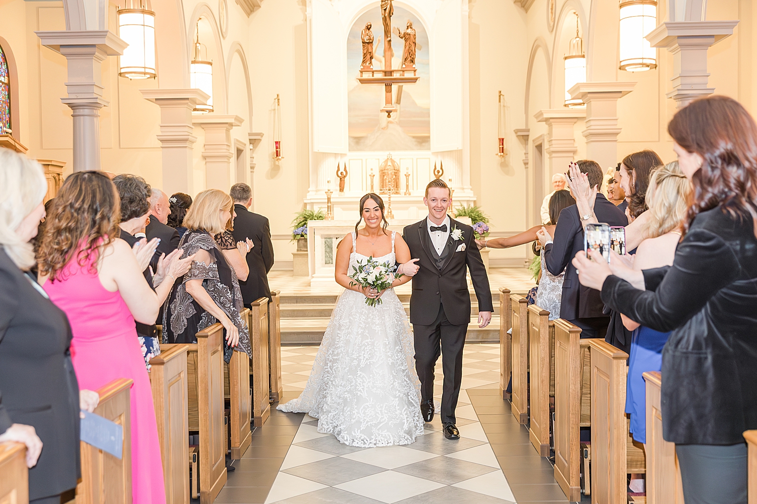 newlyweds walk down church aisle 