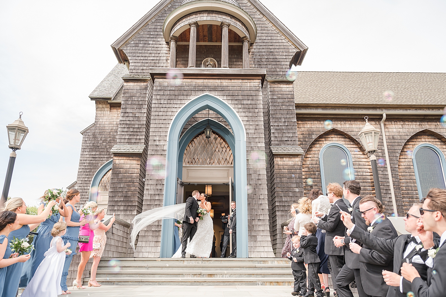 newlyweds grand wedding exit from church from Romantic Spring Wedding in New Jersey