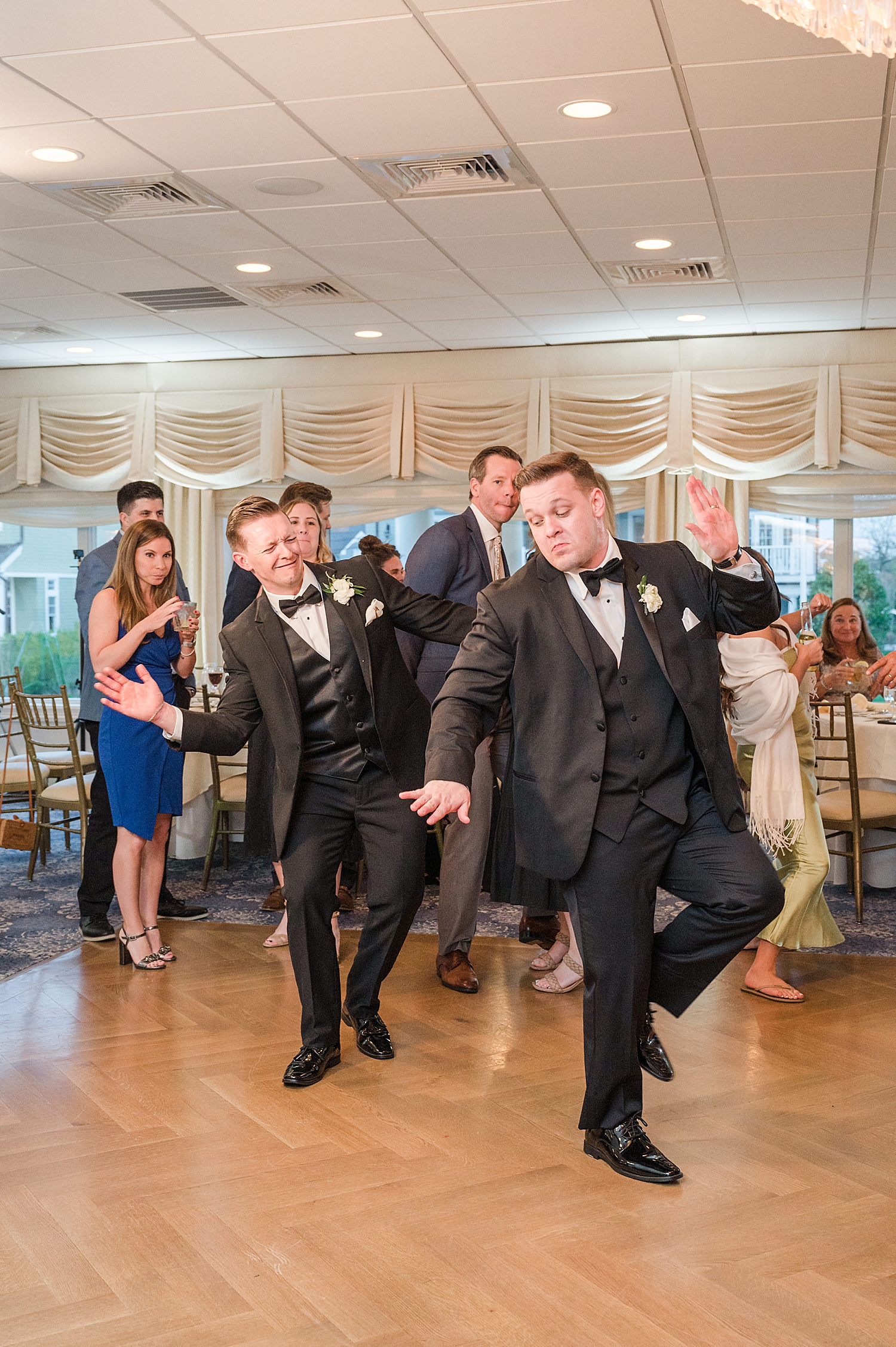 groom and groomsmen on the dance floor