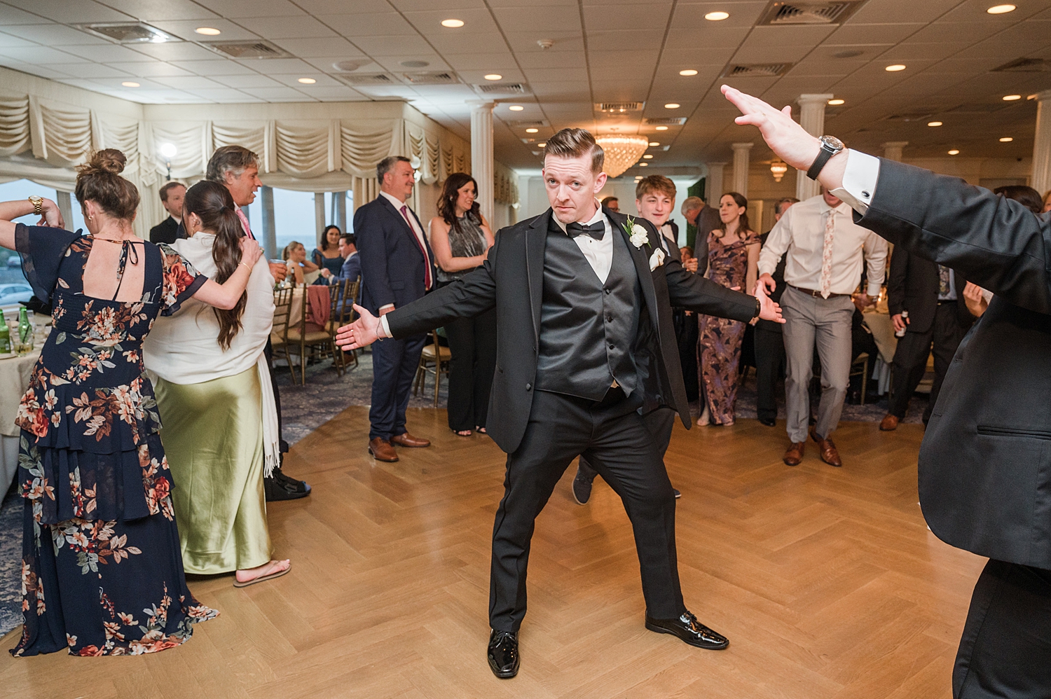 groom dancing on dance floor