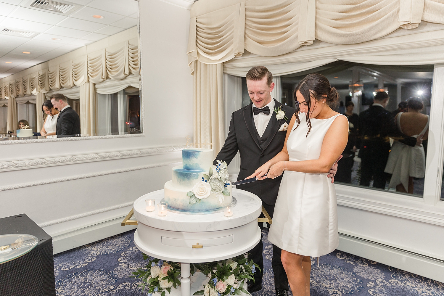 newlyweds cut wedding cake