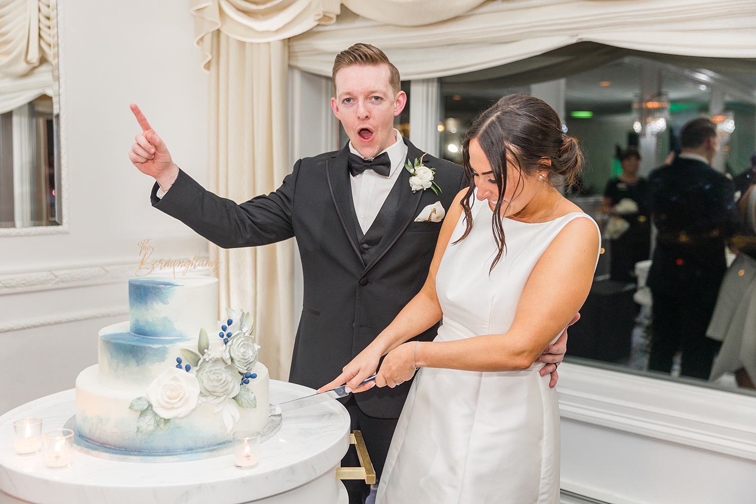 candid photos of bride and groom cutting wedding cake